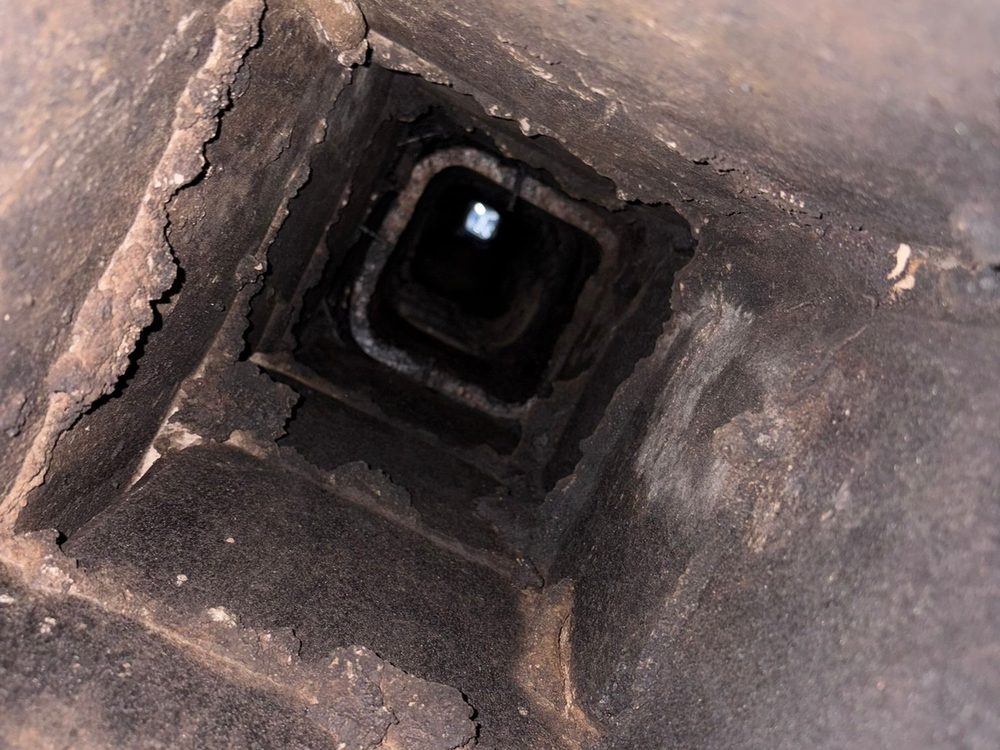 Soot built up around a chimney flue
               opening
