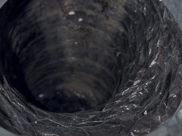 A second flexible duct run showing buildup
               along the ribbing